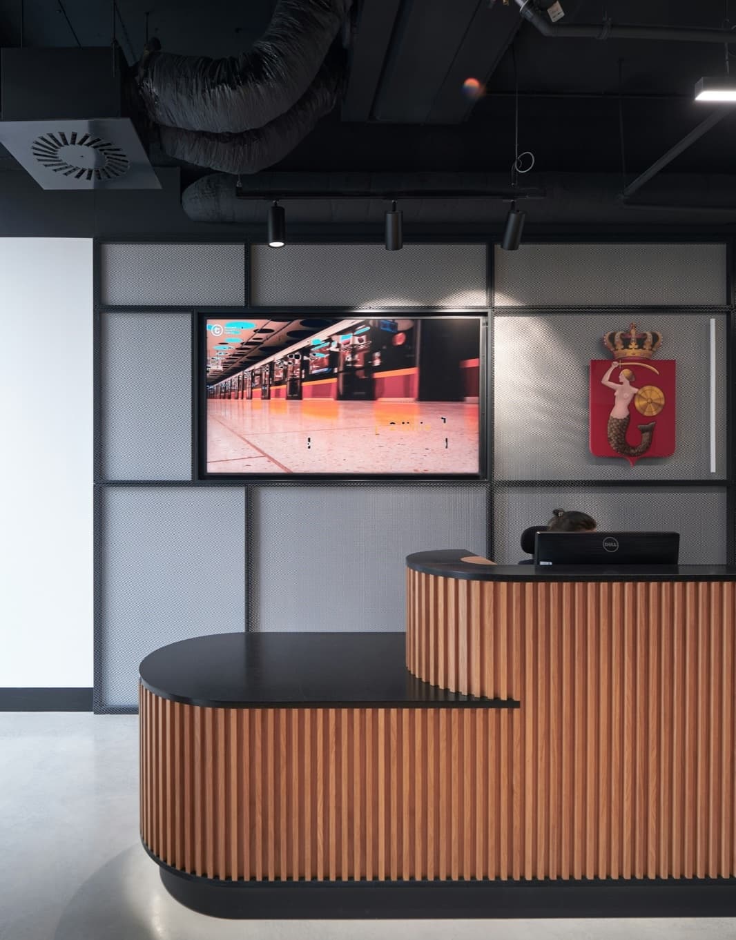 Branded signage on a screen in a hotel lobby